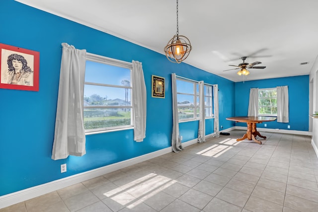 interior space with ceiling fan and light tile patterned flooring