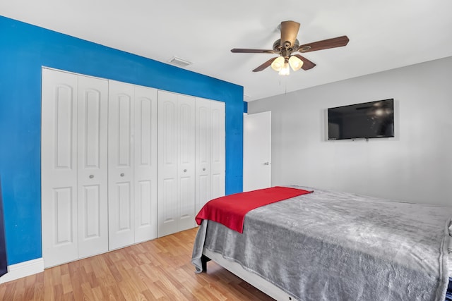 bedroom featuring light hardwood / wood-style flooring and ceiling fan