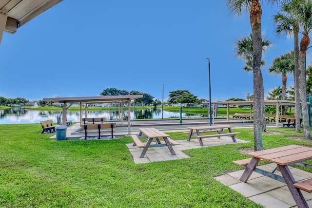 exterior space featuring a water view and a yard