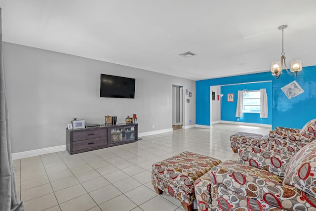 living room featuring a chandelier and light tile patterned floors