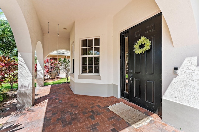 doorway to property featuring covered porch