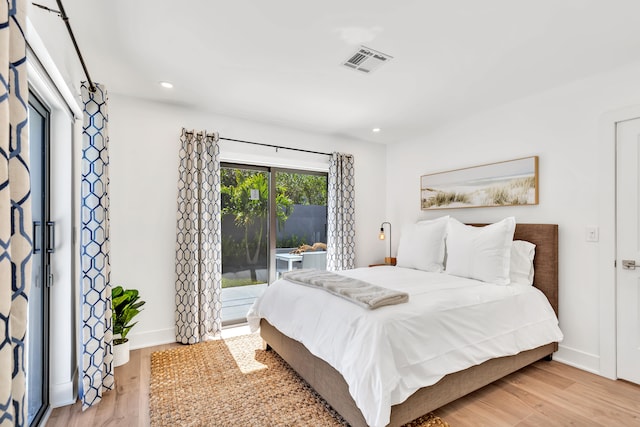 bedroom with light hardwood / wood-style floors