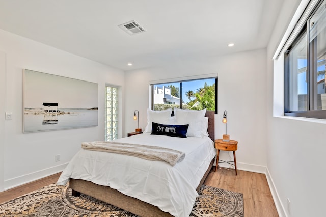 bedroom with wood-type flooring