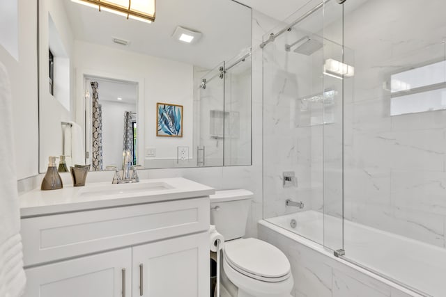 full bathroom with vanity, enclosed tub / shower combo, and toilet