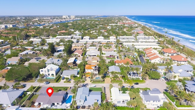 aerial view with a water view and a view of the beach