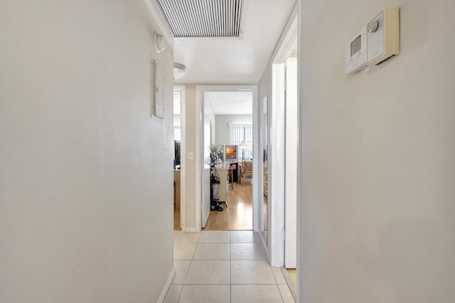 hallway with light hardwood / wood-style flooring