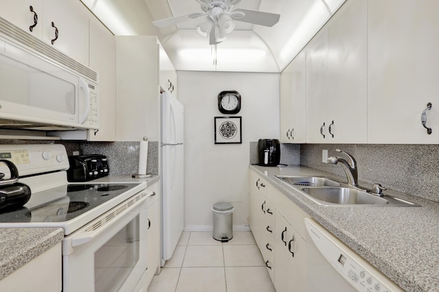 kitchen featuring ceiling fan, light tile patterned floors, sink, white appliances, and tasteful backsplash