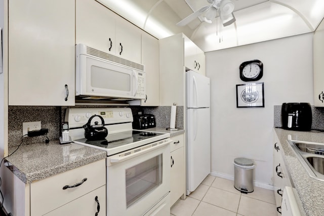 kitchen with white cabinetry, light tile patterned flooring, tasteful backsplash, white appliances, and ceiling fan