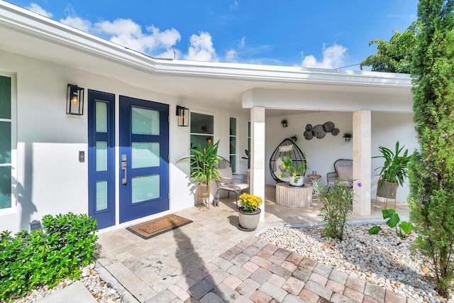 doorway to property with a porch