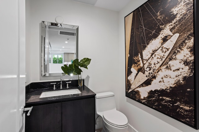 bathroom with vanity and toilet