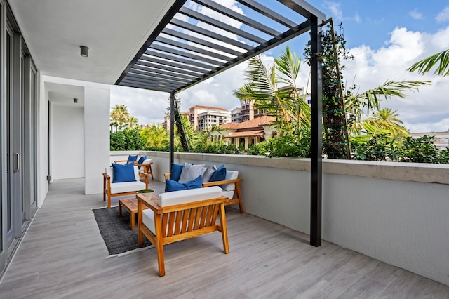 wooden deck featuring an outdoor living space and a pergola