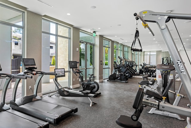 exercise room with floor to ceiling windows