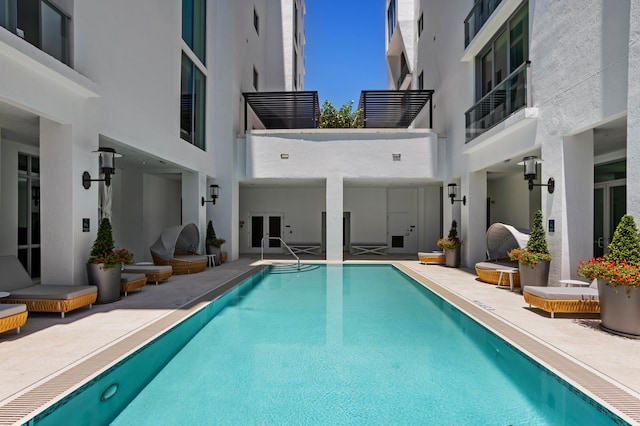 view of pool featuring a patio