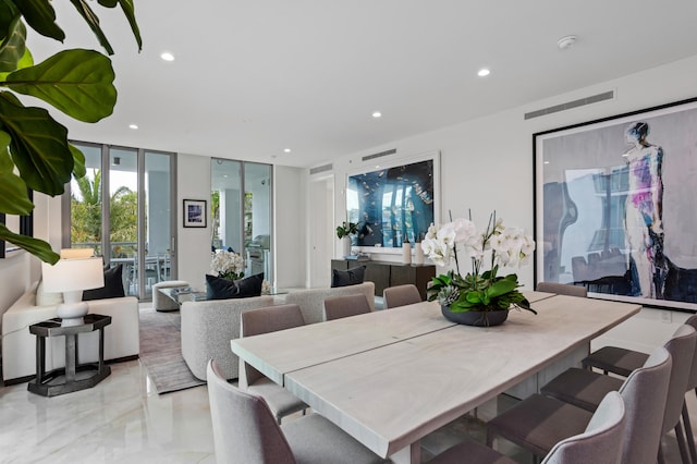 dining area featuring floor to ceiling windows