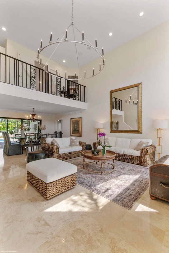 living room with a notable chandelier and a towering ceiling