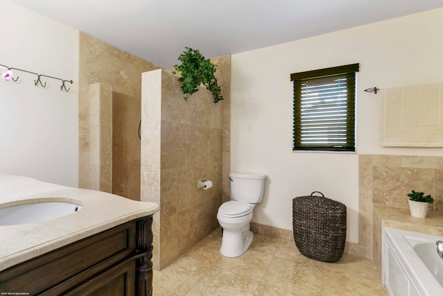 bathroom with a bathing tub, vanity, and toilet