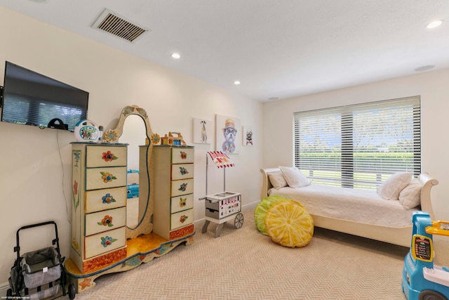 bedroom featuring light colored carpet