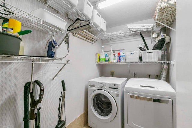 laundry room with washing machine and dryer