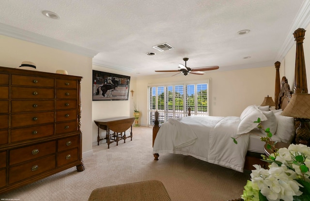 carpeted bedroom with ceiling fan, crown molding, and access to exterior