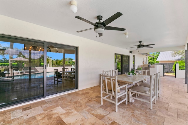 view of patio / terrace featuring ceiling fan