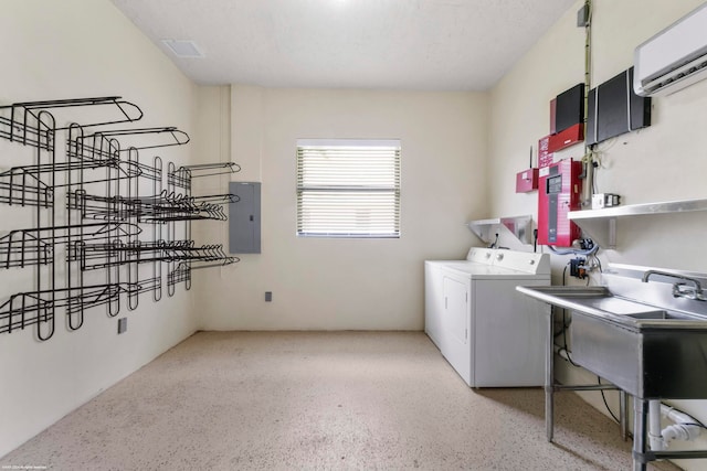 kitchen featuring a wall unit AC, appliances with stainless steel finishes, a healthy amount of sunlight, and sink