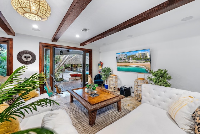 living room with beamed ceiling