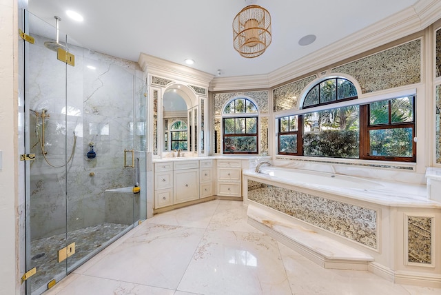 bathroom with vanity, ornamental molding, and separate shower and tub