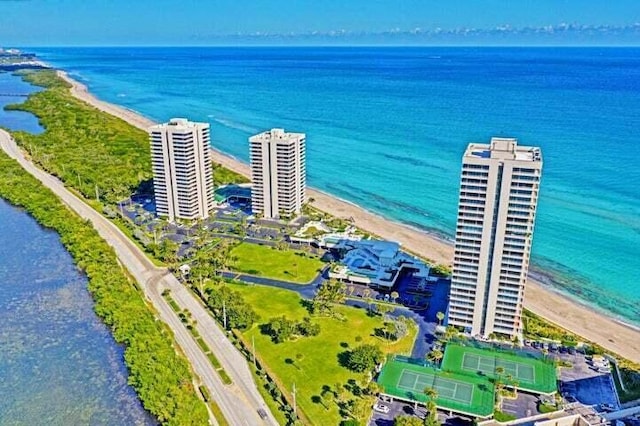 bird's eye view featuring a water view and a view of the beach