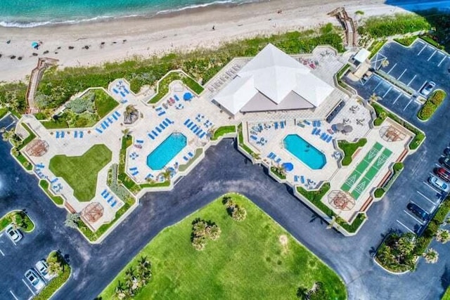 aerial view featuring a water view and a view of the beach