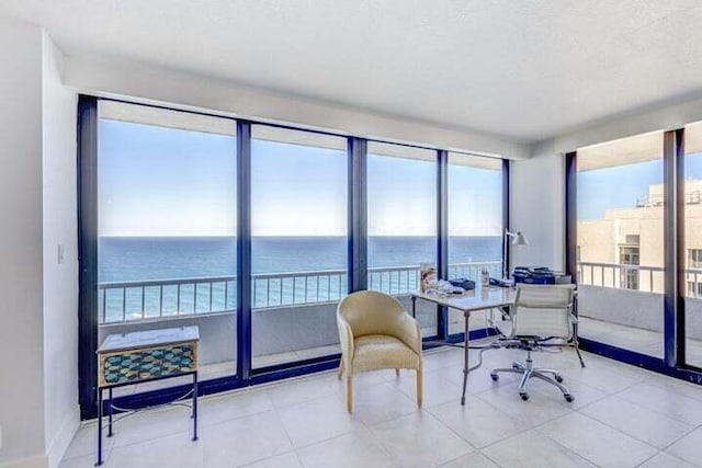 tiled office with a water view and a healthy amount of sunlight