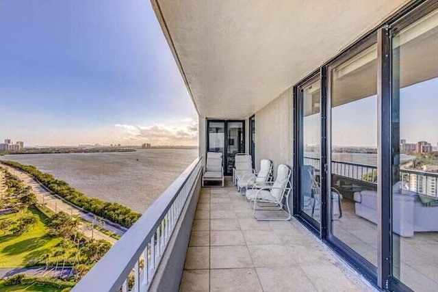 balcony featuring a water view