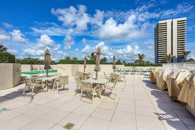 view of patio / terrace featuring a pool