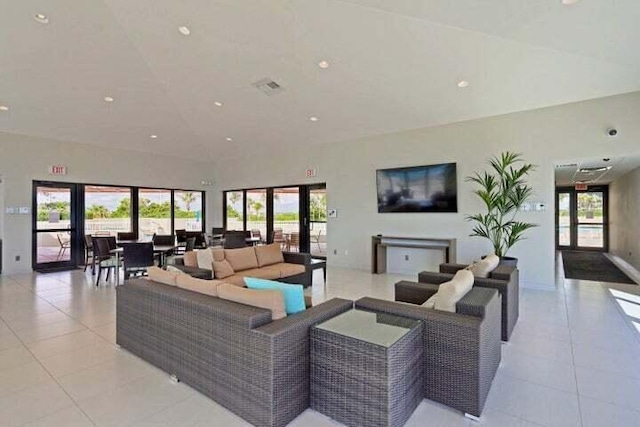 tiled living room with french doors and plenty of natural light