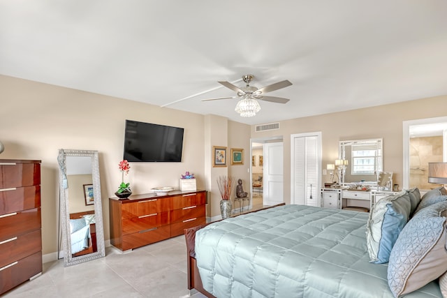 tiled bedroom with ceiling fan