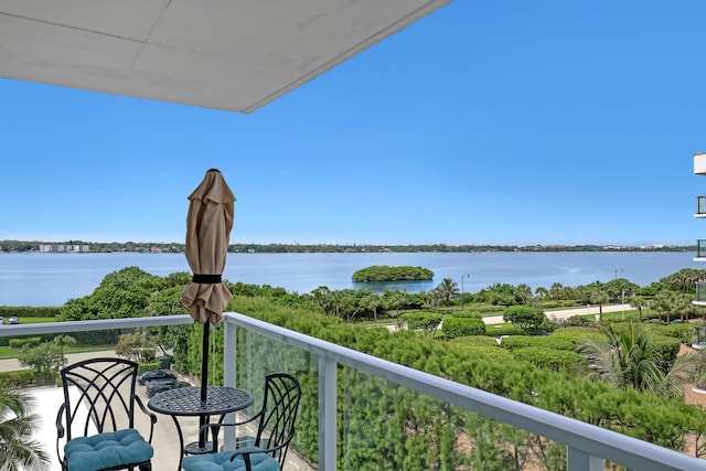 balcony featuring a water view