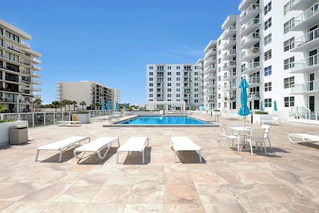 view of swimming pool with a patio