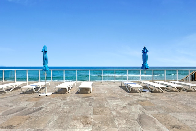 view of pool with a water view