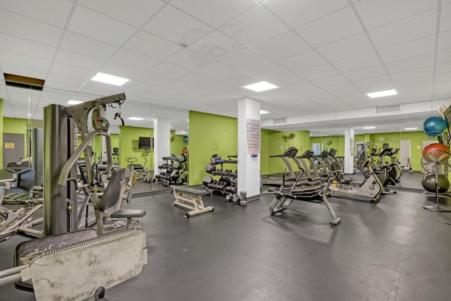 gym featuring a drop ceiling