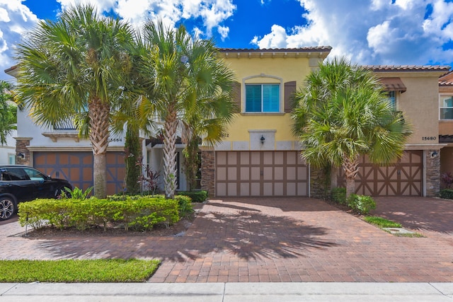 mediterranean / spanish-style home featuring a garage