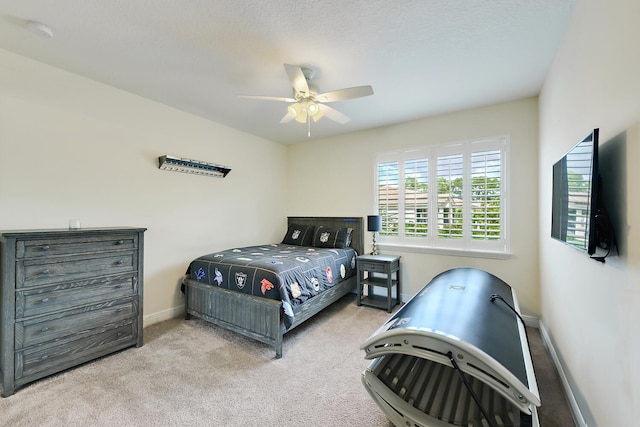 bedroom featuring light carpet and ceiling fan