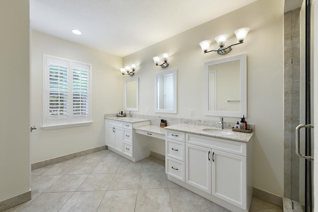 bathroom featuring vanity, tile patterned floors, and a shower with door