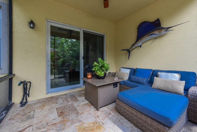 view of patio featuring an outdoor living space and ceiling fan