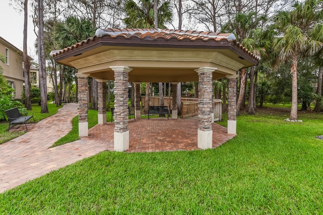 view of community featuring a lawn and a gazebo