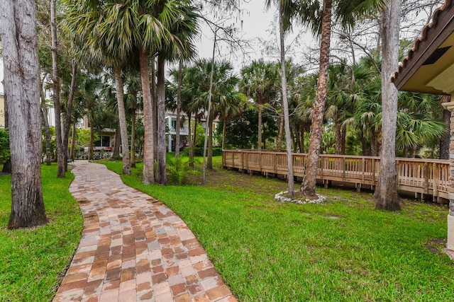 exterior space with a lawn and a wooden deck