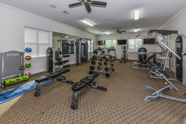 gym with a textured ceiling, crown molding, and ceiling fan