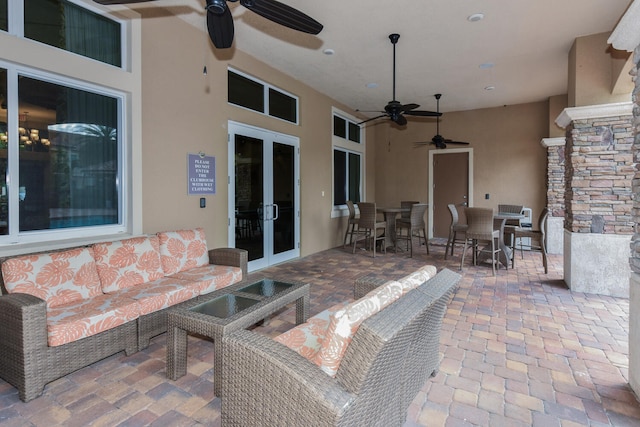 view of patio / terrace with ceiling fan and outdoor lounge area