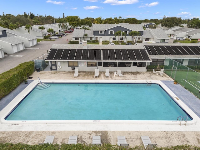 view of swimming pool featuring a patio area