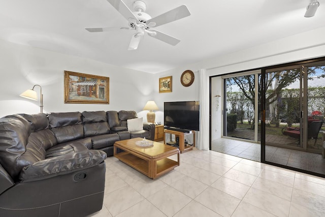 tiled living room with ceiling fan