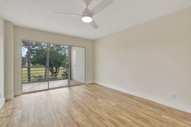 empty room with ceiling fan and light hardwood / wood-style flooring