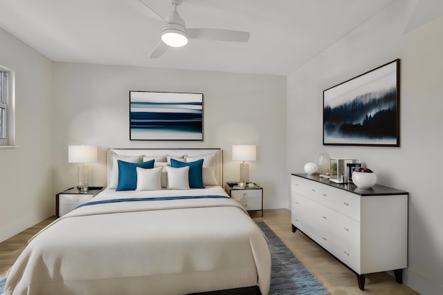 bedroom featuring light hardwood / wood-style floors and ceiling fan